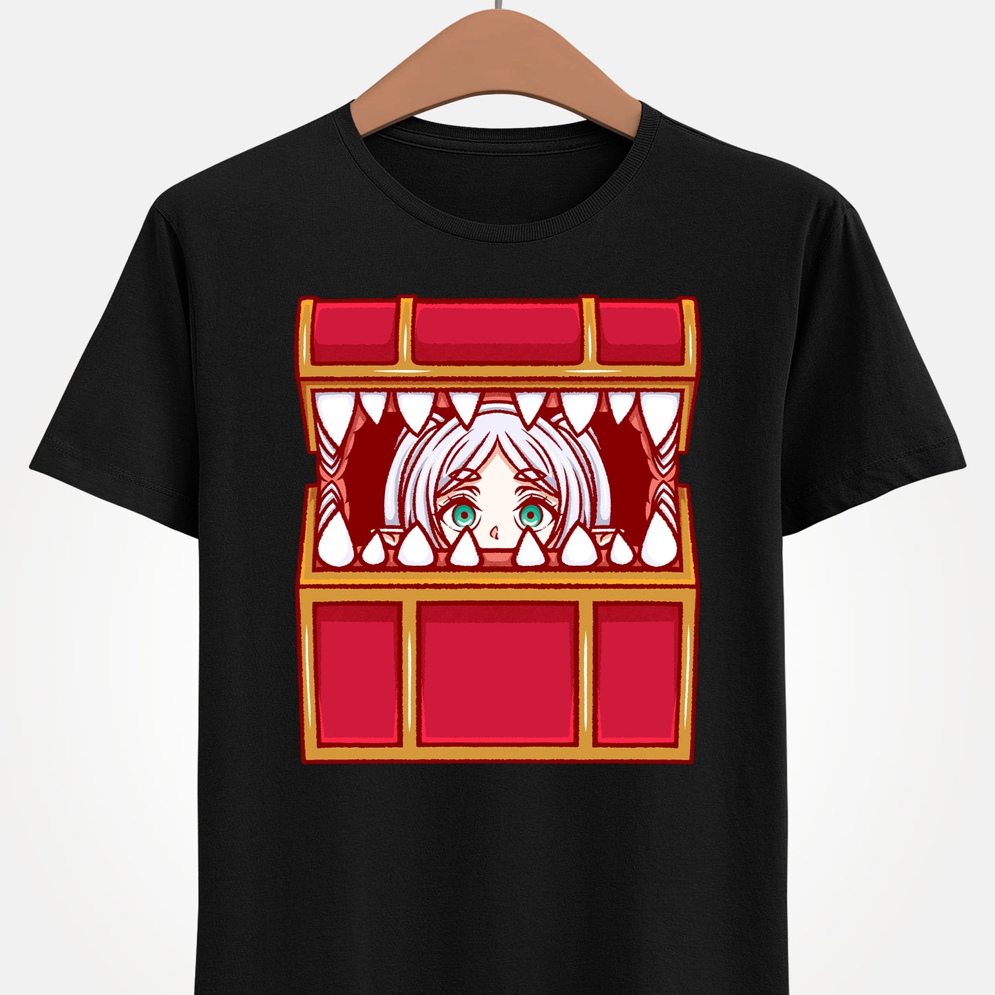Frieren Mimic t-shirt inspired by Sōsō no Frieren: Beyond Journey’s End, featuring the elf mage protagonist being playfully eaten by a treasure chest mimic in a cute kawaii art style. This unisex anime shirt captures the viral meme loved by fans across the internet. Perfect fantasy anime merch for collectors, otaku enthusiasts, and fans of Frieren who enjoy funny dungeon moments and RPG-inspired designs.