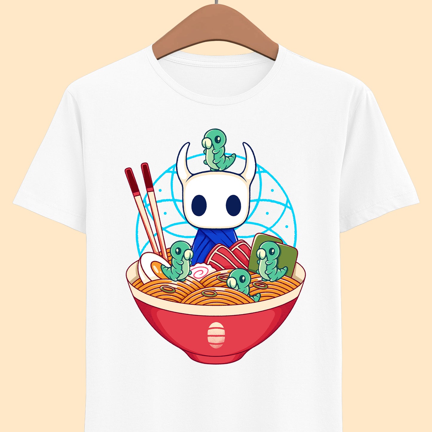 Cute Hollow Knight T-shirt featuring The Knight and adorable Grubs sitting inside a colorful ramen noodle bowl in a kawaii Japanese art style. The design blends food-themed illustration with indie game aesthetics, creating a fun and cozy look perfect for Hollow Knight fans, metroidvania lovers, ramen enthusiasts, and collectors. High-quality print ideal for gamers who enjoy cute cartoon art and unique fan-made apparel. hollow knight the knight ramen t-shirt, hollow knight ramen shirt, ramen tee