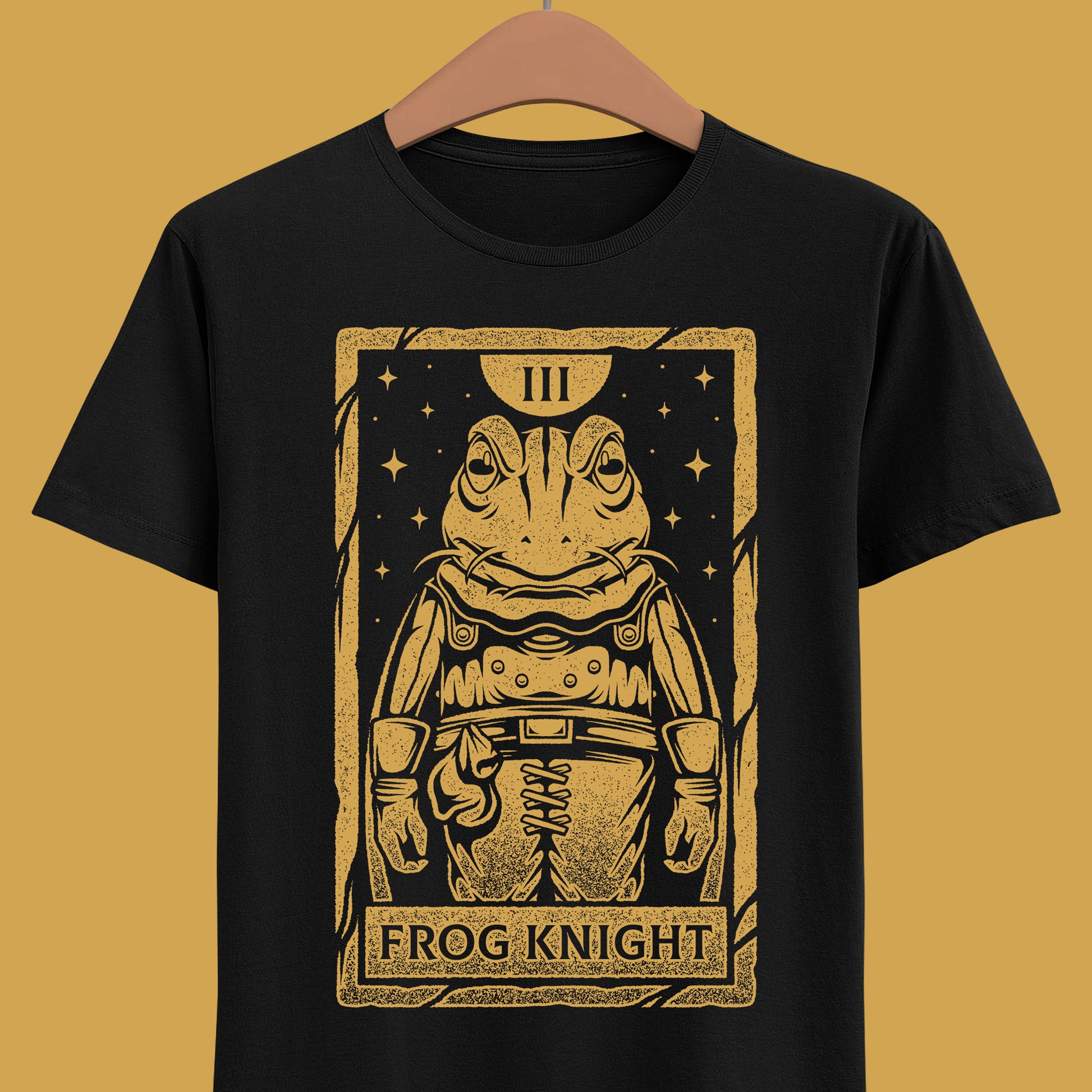 Glenn Frog Chrono Trigger tarot t-shirt inspired by the classic JRPG Chrono Trigger, originally released on SNES and PlayStation. Retro gaming apparel featuring a vintage tarot card illustration of Frog in a one-ink monochrome style. Nostalgic retrogaming design ideal for fans of Chrono Trigger merch, JRPG t-shirts, RPG video games, medieval fantasy characters, and classic SNES and PS1 gaming culture. Perfect collector shirt for retro RPG and vintage art lovers. Glenn frog chrono trigger t-shirt