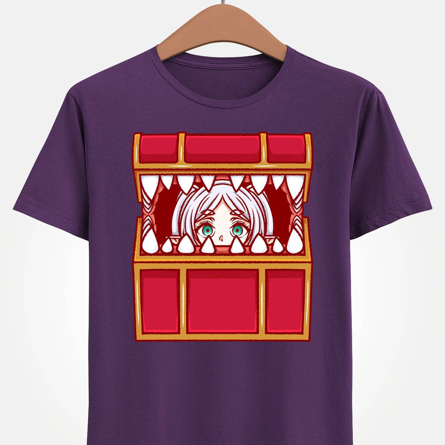 Frieren Mimic t-shirt inspired by Sōsō no Frieren: Beyond Journey’s End, featuring the elf mage protagonist being playfully eaten by a treasure chest mimic in a cute kawaii art style. This unisex anime shirt captures the viral meme loved by fans across the internet. Perfect fantasy anime merch for collectors, otaku enthusiasts, and fans of Frieren who enjoy funny dungeon moments and RPG-inspired designs.