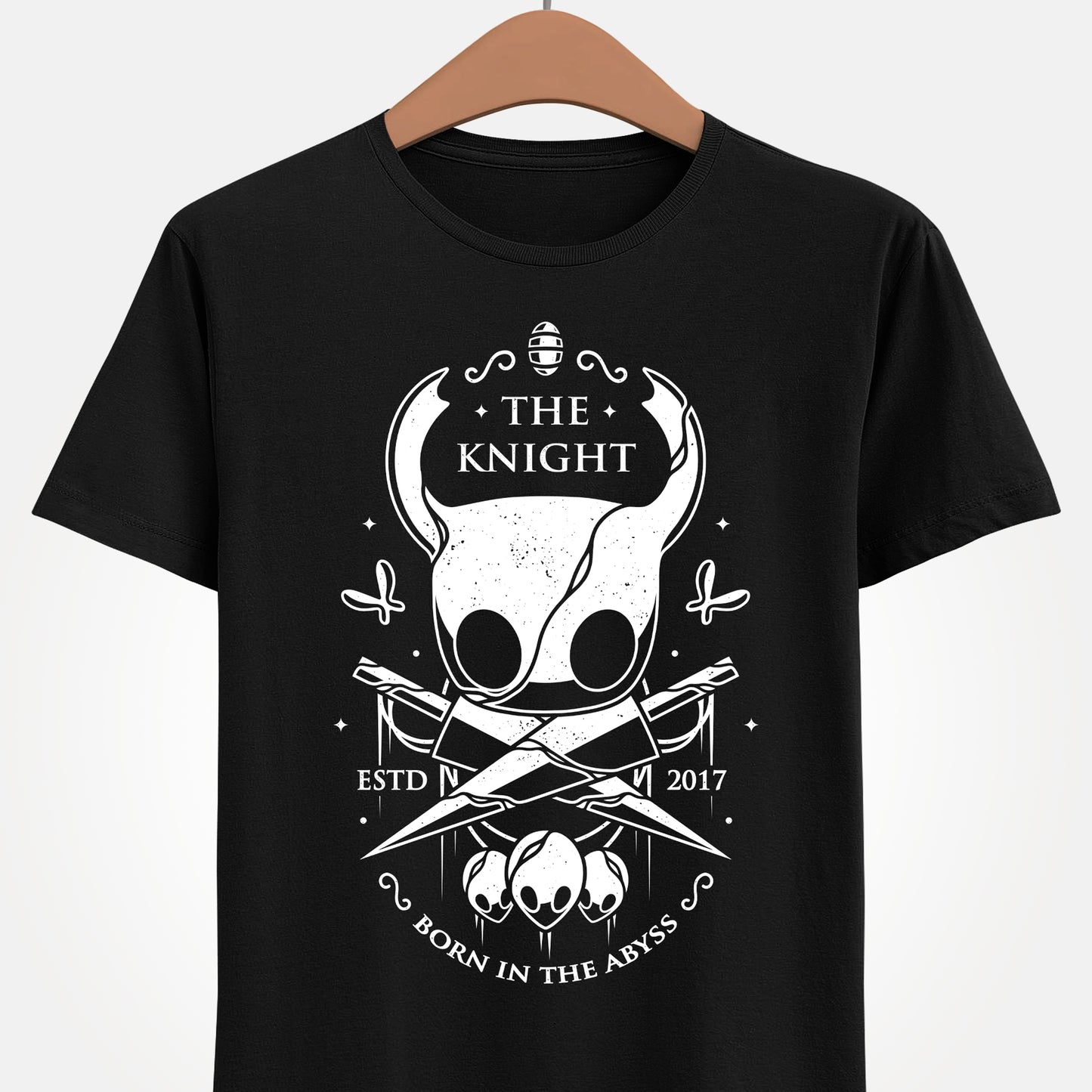 The Knight Hollow Knight t-shirt featuring the iconic Vessel from the indie metroidvania video game Hollow Knight. Atmospheric gamer apparel inspired by Hallownest, perfect for fans of The Knight, indie games, dark fantasy aesthetics, and Hollow Knight merch. Unisex video game shirt ideal as a gift for gamers and collectors. hollow knight merch, hollow knight the knight t-shirt, the knight hollow knight video game t-shirt, hollow knight exclusive merch, hollow knight silksong t-shirt