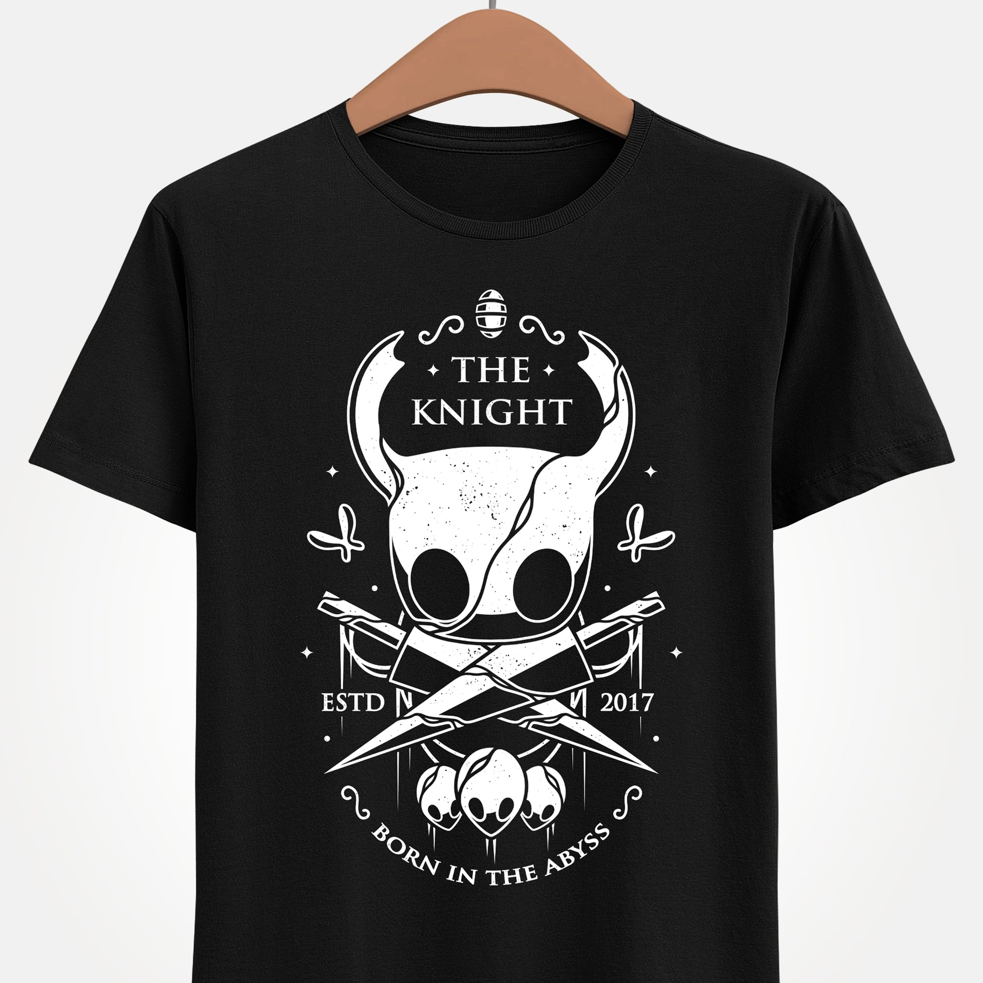 The Knight Hollow Knight t-shirt featuring the iconic Vessel from the indie metroidvania video game Hollow Knight. Atmospheric gamer apparel inspired by Hallownest, perfect for fans of The Knight, indie games, dark fantasy aesthetics, and Hollow Knight merch. Unisex video game shirt ideal as a gift for gamers and collectors. hollow knight merch, hollow knight the knight t-shirt, the knight hollow knight video game t-shirt, hollow knight exclusive merch, hollow knight silksong t-shirt