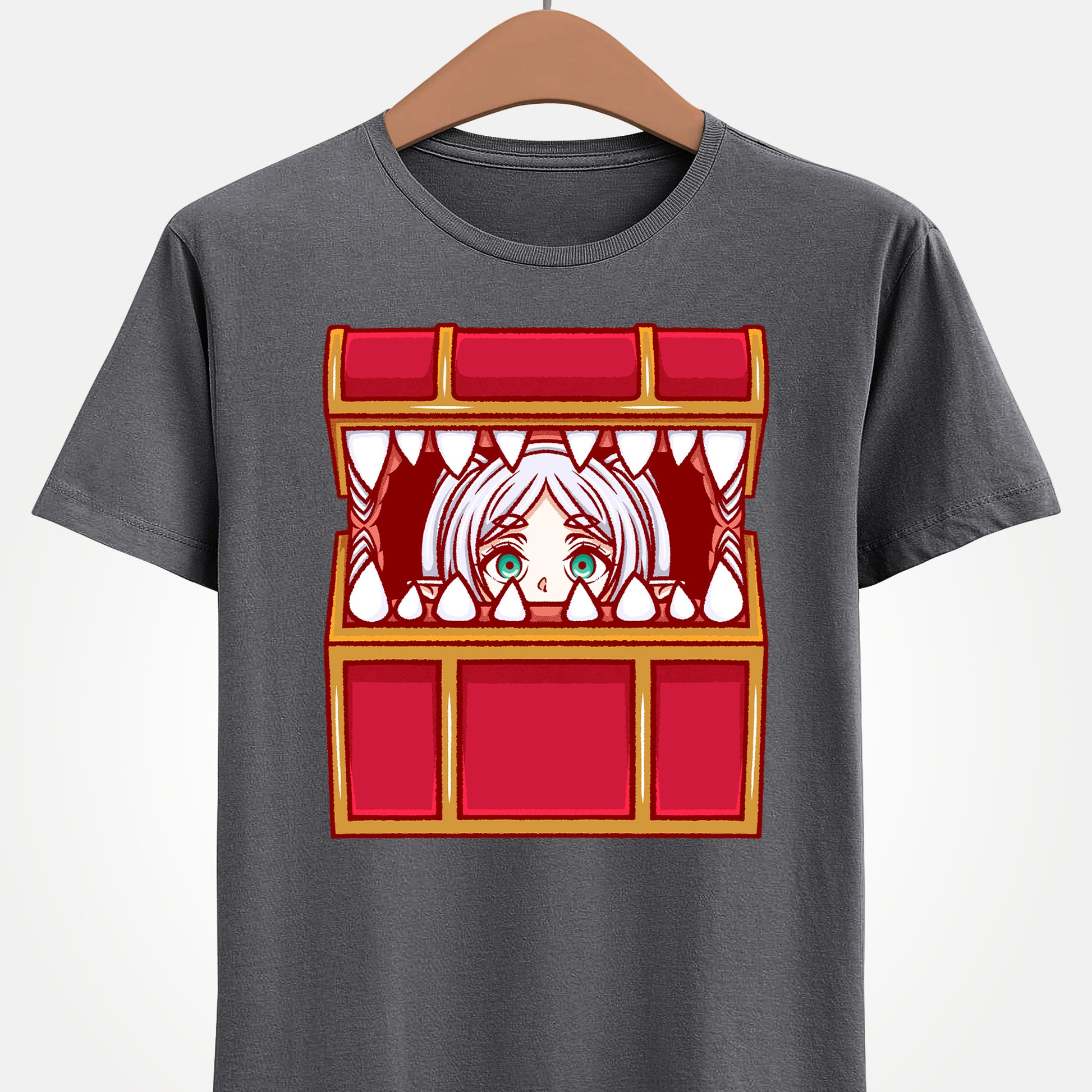 Frieren Mimic t-shirt inspired by Sōsō no Frieren: Beyond Journey’s End, featuring the elf mage protagonist being playfully eaten by a treasure chest mimic in a cute kawaii art style. This unisex anime shirt captures the viral meme loved by fans across the internet. Perfect fantasy anime merch for collectors, otaku enthusiasts, and fans of Frieren who enjoy funny dungeon moments and RPG-inspired designs.