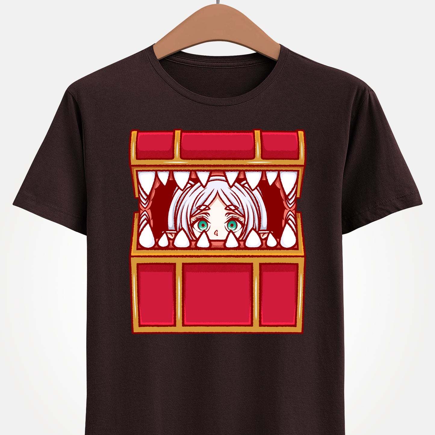 Frieren Mimic t-shirt inspired by Sōsō no Frieren: Beyond Journey’s End, featuring the elf mage protagonist being playfully eaten by a treasure chest mimic in a cute kawaii art style. This unisex anime shirt captures the viral meme loved by fans across the internet. Perfect fantasy anime merch for collectors, otaku enthusiasts, and fans of Frieren who enjoy funny dungeon moments and RPG-inspired designs.