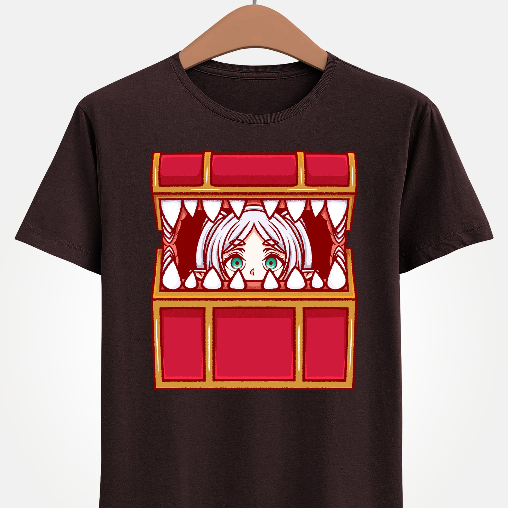 Frieren Mimic t-shirt inspired by Sōsō no Frieren: Beyond Journey’s End, featuring the elf mage protagonist being playfully eaten by a treasure chest mimic in a cute kawaii art style. This unisex anime shirt captures the viral meme loved by fans across the internet. Perfect fantasy anime merch for collectors, otaku enthusiasts, and fans of Frieren who enjoy funny dungeon moments and RPG-inspired designs.