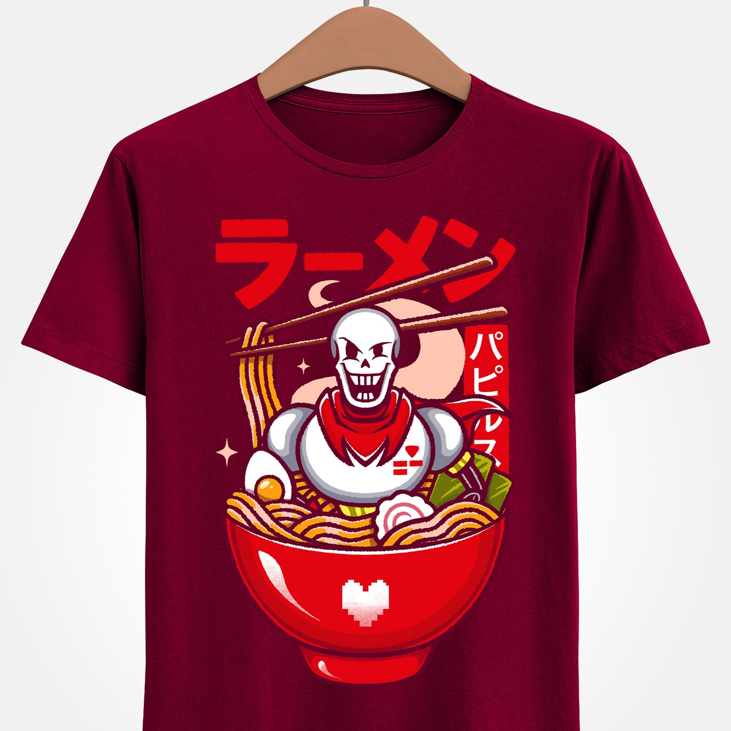 Image of a Papyrus T-shirt inspired by the indie game Undertale, featuring Papyrus sitting inside a Japanese ramen bowl in a cute kawaii art style. The design includes noodles, chopsticks and bright manga-style colors, perfect for fans of Papyrus, Sans, Undyne and the Undertale cast. Ideal for gamers who love Japanese food, ramen-themed apparel, geek culture, and unique Undertale merch with a playful aesthetic. papyrus undertale t-shirt, papyrus undertale video game merch, papyrus undertale tee