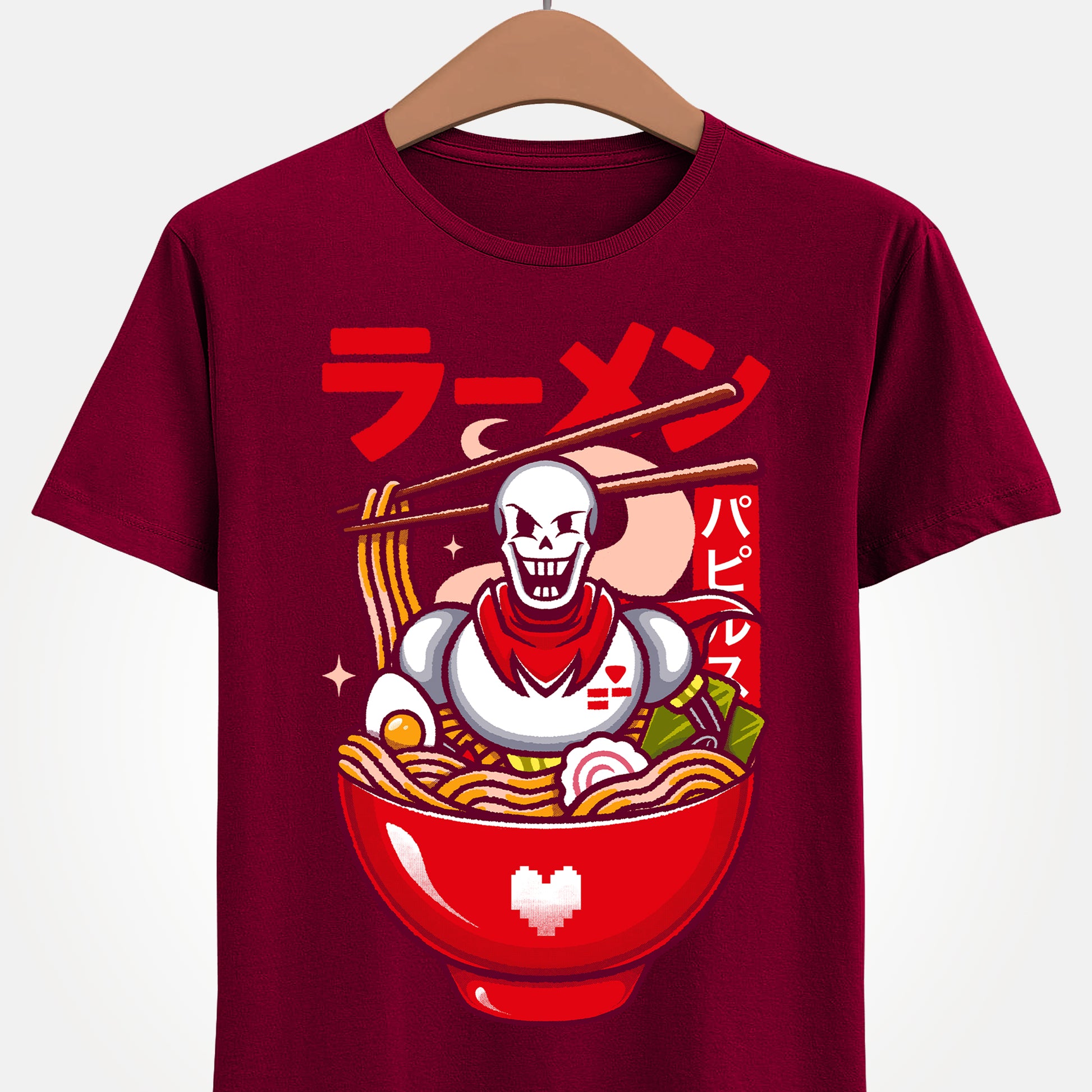 Image of a Papyrus T-shirt inspired by the indie game Undertale, featuring Papyrus sitting inside a Japanese ramen bowl in a cute kawaii art style. The design includes noodles, chopsticks and bright manga-style colors, perfect for fans of Papyrus, Sans, Undyne and the Undertale cast. Ideal for gamers who love Japanese food, ramen-themed apparel, geek culture, and unique Undertale merch with a playful aesthetic. papyrus undertale t-shirt, papyrus undertale video game merch, papyrus undertale tee