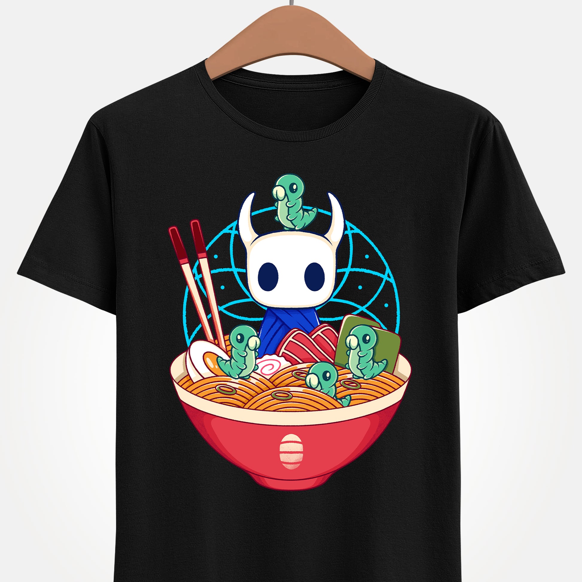 Cute Hollow Knight T-shirt featuring The Knight and adorable Grubs sitting inside a colorful ramen noodle bowl in a kawaii Japanese art style. The design blends food-themed illustration with indie game aesthetics, creating a fun and cozy look perfect for Hollow Knight fans, metroidvania lovers, ramen enthusiasts, and collectors. High-quality print ideal for gamers who enjoy cute cartoon art and unique fan-made apparel. hollow knight the knight ramen t-shirt, hollow knight ramen shirt, ramen tee
