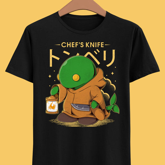 Gamer T-shirt inspired by Tonberry from Final Fantasy video games using Chef's Knife skill. Perfect shirt for Final Fantasy video games fans (Final Fantasy VII, Final Fantasy VII Rebirth, Final Final Fantasy XIV, FFXIV, FF14, FFVII, Final Fantasy VIII, Final Fantasy IX).

cloud strife t-shirt, aerith gainsborough t-shirt, final fantasy vii rebirth t-shirt, barret wallace t-shirt, red xiii, red xiii t-shirt, nanaki, nanaki t-shirt, final fantasy clothing, final fantasy tonberry t-shirt, final fantasy shirt