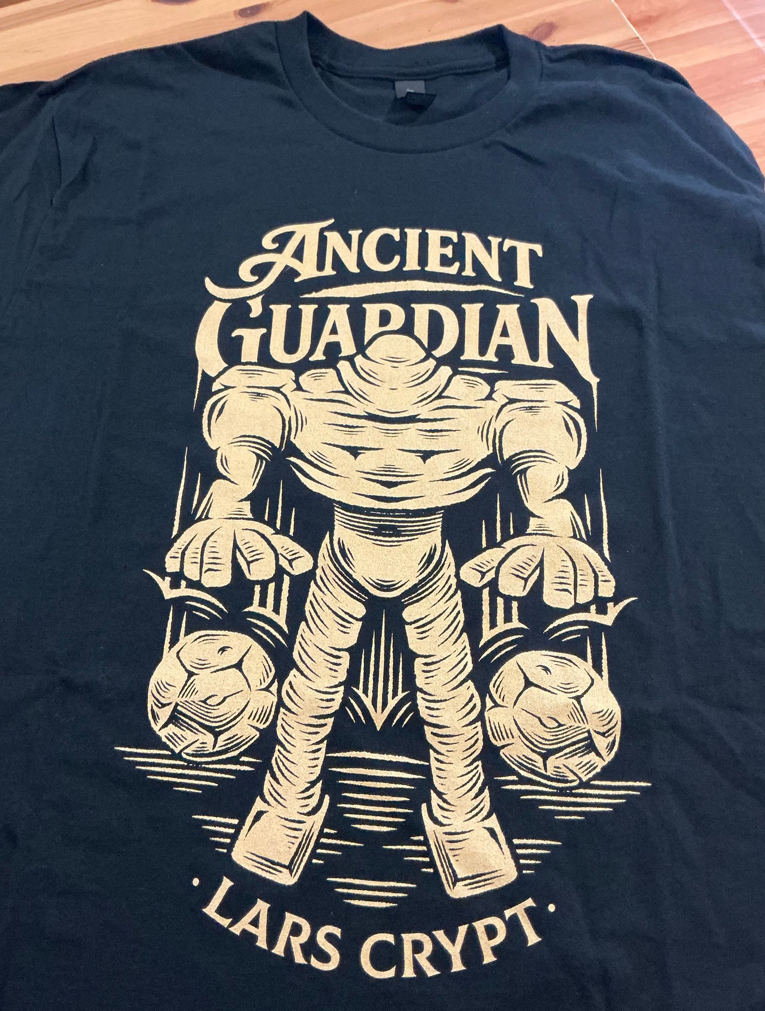 Real printed Alundra Ancient Guardian T-shirt featuring the Lars Crypt boss design with high-resolution DTG print quality and vibrant colors