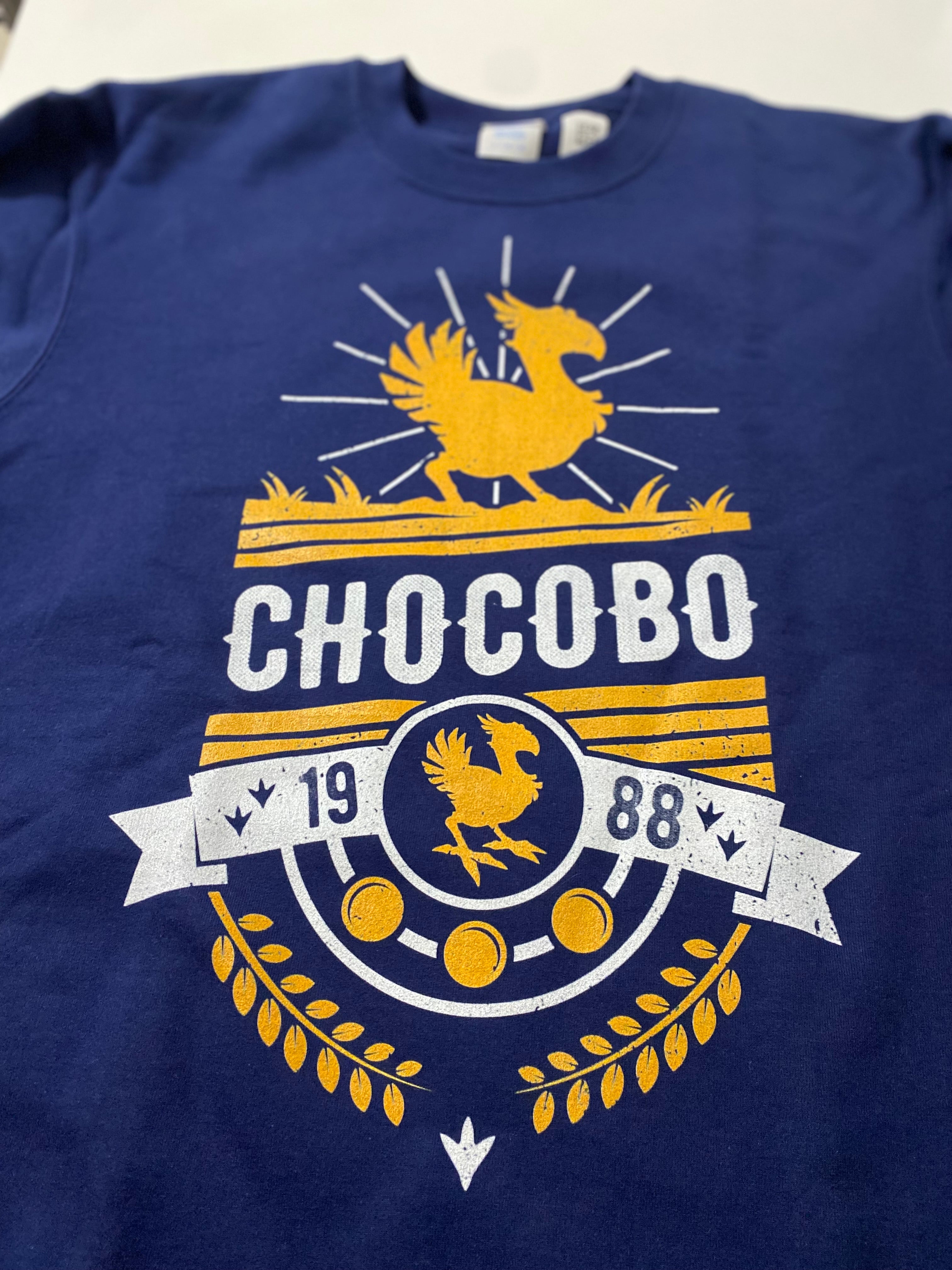 Close-up of DTG printed Chocobo artwork on premium cotton T-shirt showing color accuracy and fine detail