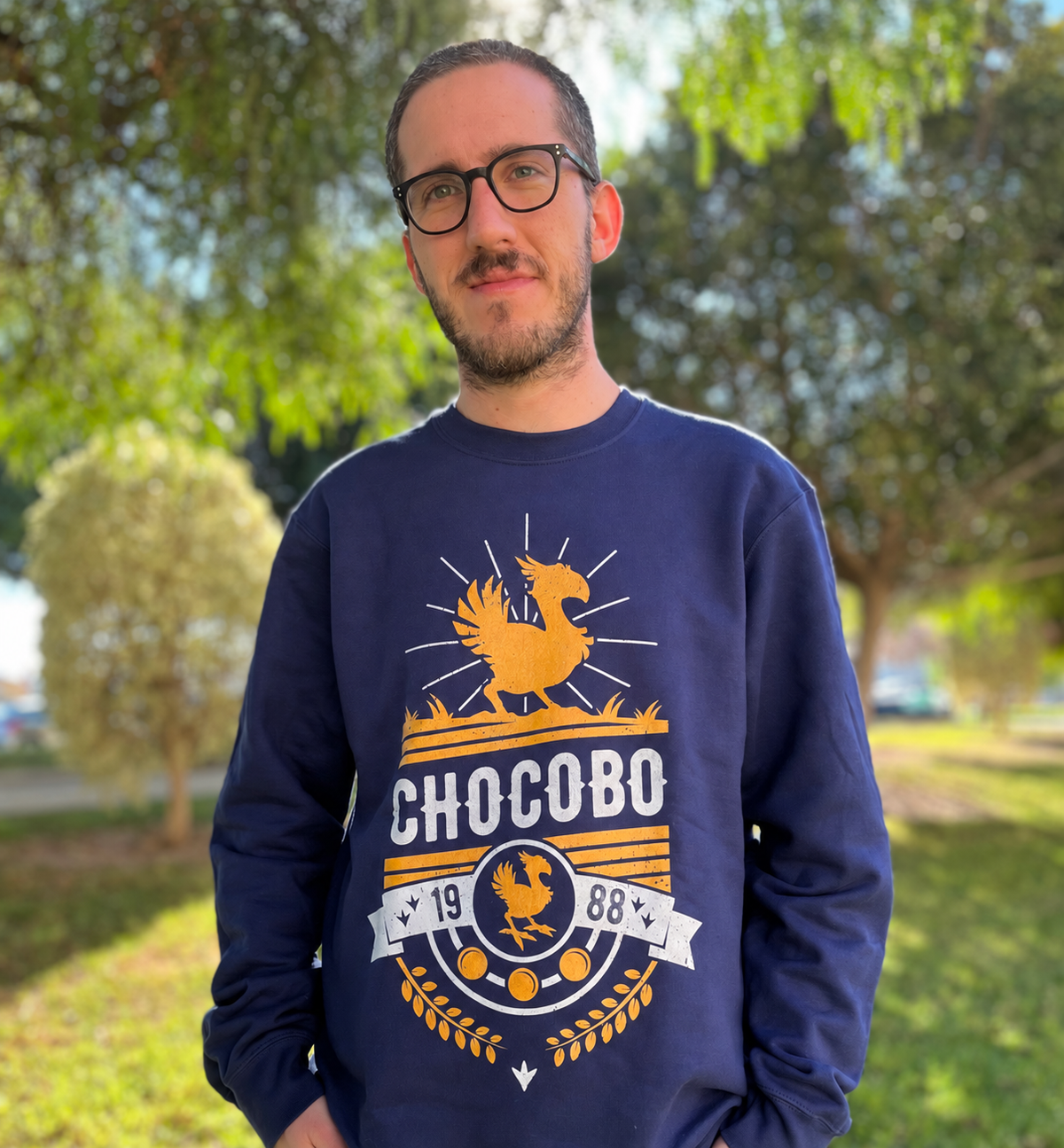 Real Alundrart crewneck sweatshirt worn outdoors, showing the finished printed Chocobo inspired artwork.